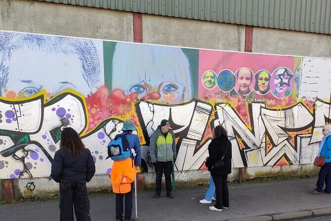 Belfast Troubles Tour: Walls and Bridges - Dan George sculpture and the city-centre bridge to context