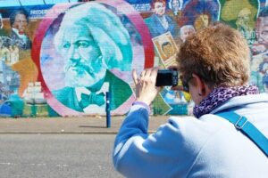 Private Belfast Troubles Cab Tour Adventure 2hrs Personal Guide - Starting at the Falls Road murals: Divis, Gerry Conlon, and the street’s “welcome”